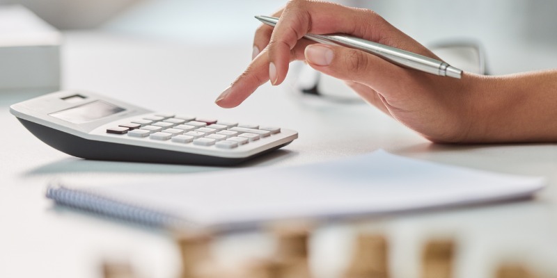 Woman using calculator