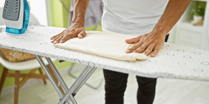 Ironing board in laundry area